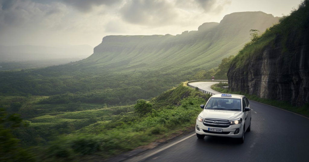 Scenic road trip experience with Ahmedabad to Lonavala taxi service through hill station